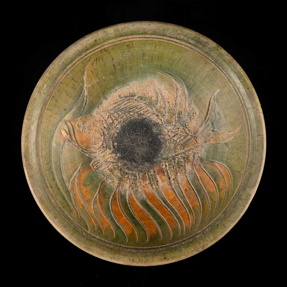 A THAI GREEN & AMBER GLAZED CERAMIC DISH WITH CARP