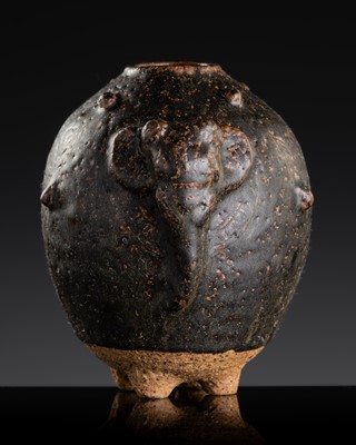 Lot 139 - A DARK-BROWN GLAZED STONEWARE ‘ELEPHANT’ LIME POT, ANGKOR PERIOD