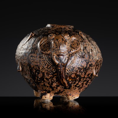Lot 147 - A DARK-BROWN GLAZED STONEWARE ‘ELEPHANT’ LIME POT, SAWANKHALOK