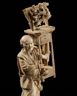 Lot 412 - KAZUO: A FINE IVORY OKIMONO OF A STREET VENDOR