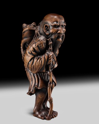 Lot 177 - HARUMITSU: A SUPERB WOOD NETSUKE OF GAMA SENNIN WITH A LARGE TOAD