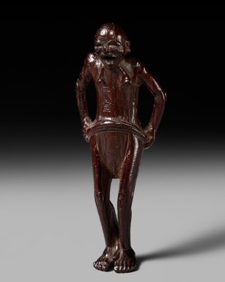 Lot 235 - AN UNUSUAL WOOD NETSUKE OF A NAKED MAN TYING HIS FUNDOSHI