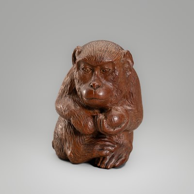 TOKO: A LARGE BOXWOOD NETSUKE DEPICTING A MONKEY