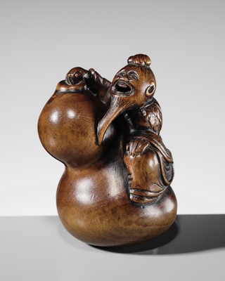 A FINE WOOD NETSUKE OF CHOKARO SENNIN WITH A LARGE GOURD