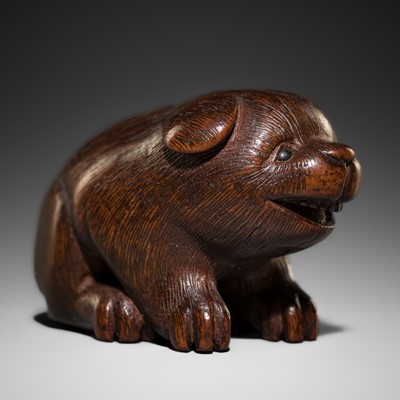 Lot 326 - A CHARMING WOOD NETSUKE OF A PUPPY, ATTRIBUTED TO RANICHI