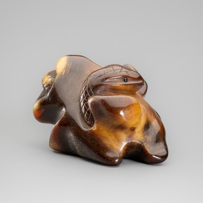 A HORN NETSUKE DEPICTING A SNAKE