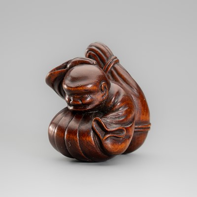 A FINE WOOD NETSUKE OF A BLIND MUSICIAN, ATTRIBUTED TO MASAKAZU