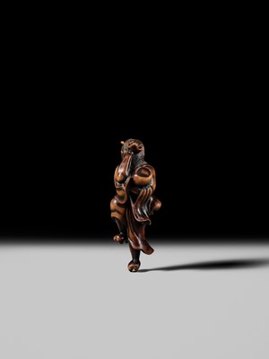 Lot 93 - YOSHIMASA: A SUPERB WOOD NETSUKE OF THE DEMON IBARAKI