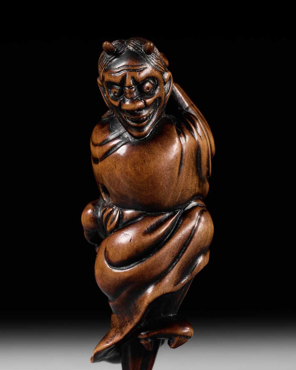 Lot 93 - YOSHIMASA: A SUPERB WOOD NETSUKE OF THE DEMON IBARAKI