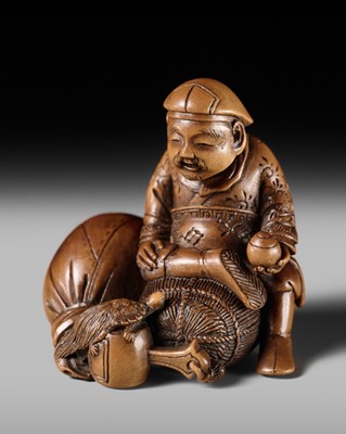 Lot 268 - HOJITSU: A SUPERB WOOD NETSUKE OF DAIKOKU WITH A MINOGAME