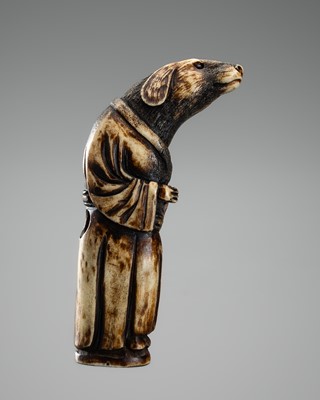 AN UNUSUAL ANTLER NETSUKE DEPICTING A DOG PRIEST