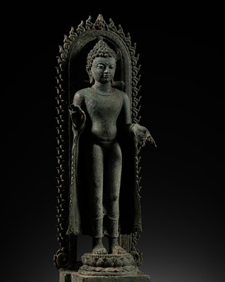 Lot 239 - A BRONZE FIGURE OF BUDDHA WITHIN A FLAMING AUREOLE, CENTRAL JAVA, 8TH-9TH CENTURY