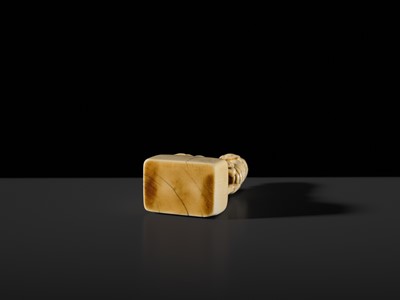 Lot 99 - MUNEHARU: A FINE KYOTO SCHOOL IVORY SEAL-TYPE (INGYO) NETSUKE OF A YOUNG KIRIN