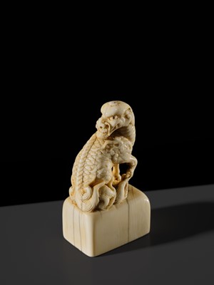 Lot 99 - MUNEHARU: A FINE KYOTO SCHOOL IVORY SEAL-TYPE (INGYO) NETSUKE OF A YOUNG KIRIN