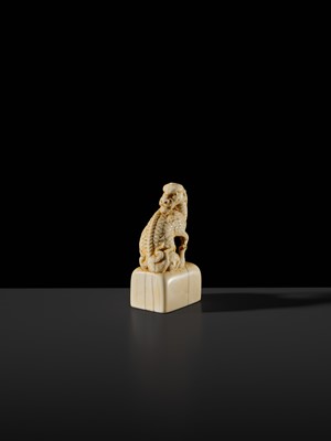 Lot 99 - MUNEHARU: A FINE KYOTO SCHOOL IVORY SEAL-TYPE (INGYO) NETSUKE OF A YOUNG KIRIN