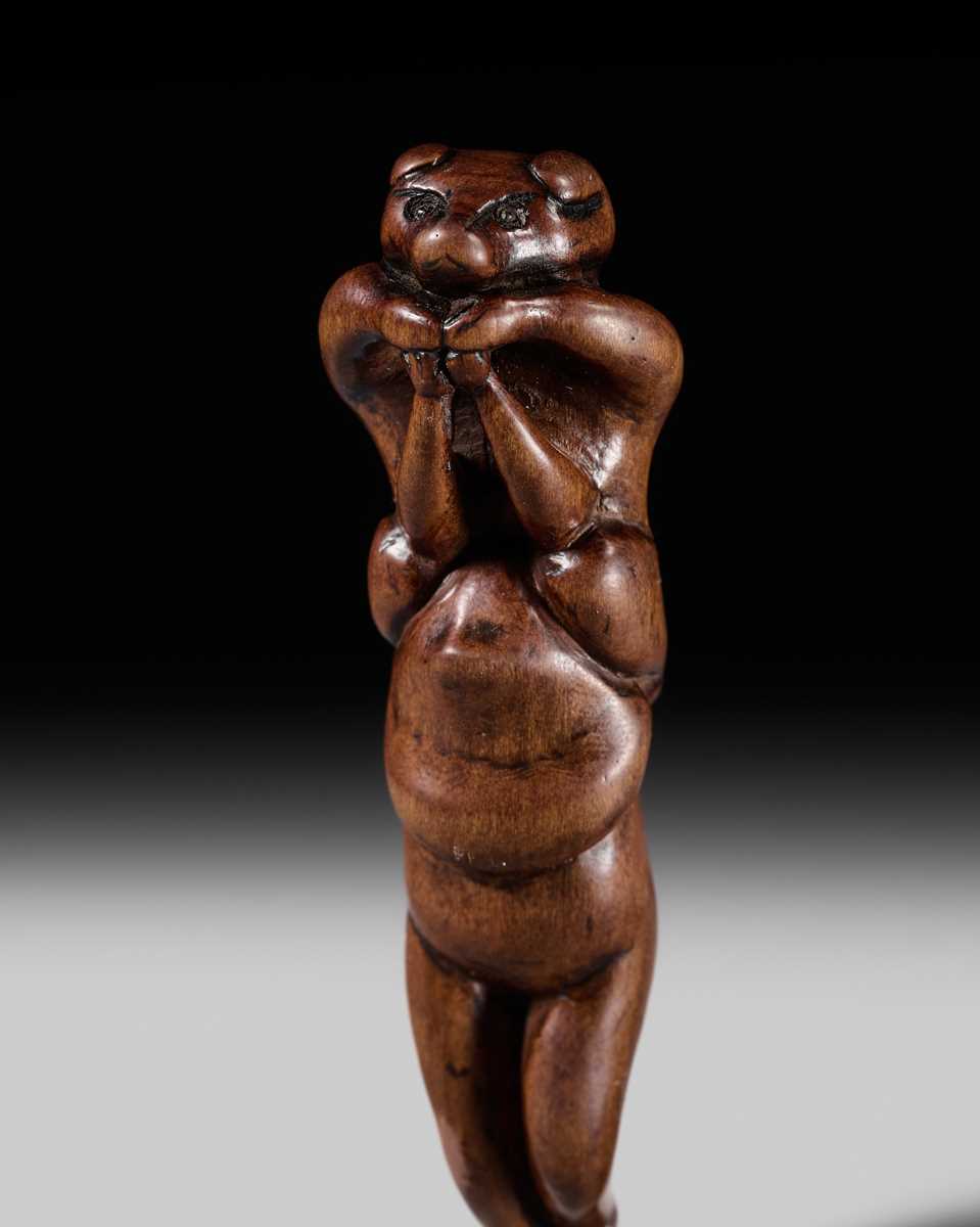 Lot 85 - A RARE AND AMUSING WOOD NETSUKE OF TWO TANUKI
