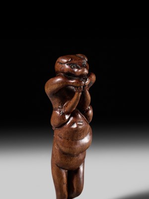 Lot 85 - A RARE AND AMUSING WOOD NETSUKE OF TWO TANUKI