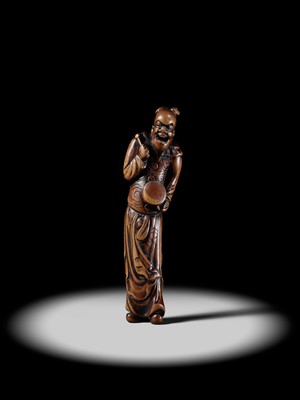 Lot 84 - A TALL AND SUPERB WOOD NETSUKE OF A CHINESE DRUMMER