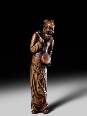 Lot 84 - A TALL AND SUPERB WOOD NETSUKE OF A CHINESE DRUMMER