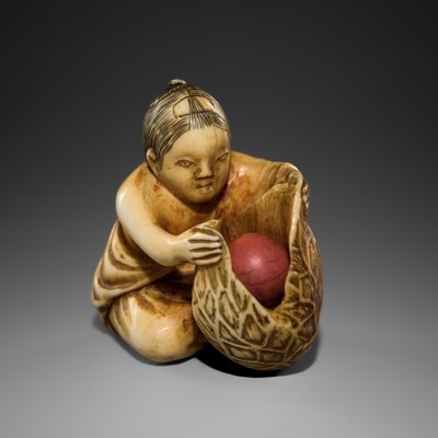Lot 294 - A FINE IVORY NETSUKE OF A BOY WITH A HOZUKI