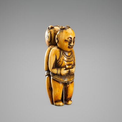 Lot 266 - AN IVORY KARAKURI (TRICK) NETSUKE OF TWINS