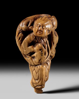 AN OLD IVORY NETSUKE OF BASHIKO SENNIN