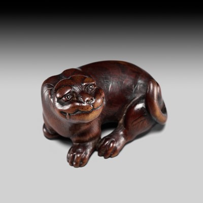 Lot 109 - RANTEI: A RARE WOOD NETSUKE OF A TIGER