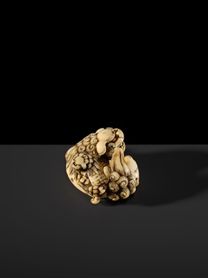 Lot 104 - A LARGE IVORY NETSUKE OF A SHISHI AND ITS YOUNG