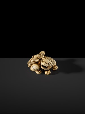 Lot 104 - A LARGE IVORY NETSUKE OF A SHISHI AND ITS YOUNG