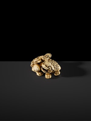 Lot 104 - A LARGE IVORY NETSUKE OF A SHISHI AND ITS YOUNG