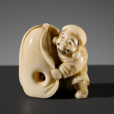 Lot 505 - A CHARMING WALRUS TUSK KARAKURI (TRICK) NETSUKE OF DAIKOKU WITH A MOVABLE RAT