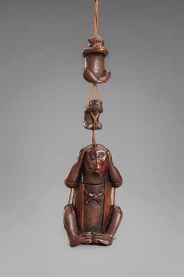 Lot 647 - GYOKUSEKI: A WOOD TONKOTSU WITH MATCHING NETSUKE AND OJIME OF THE SAMBIKI SARU (THREE WISE MONKEYS)