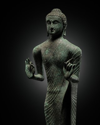 Lot 240 - A RARE AND LARGE BRONZE FIGURE OF THE EMACIATED BUDDHA, INDONESIA, 8TH-9TH CENTURY