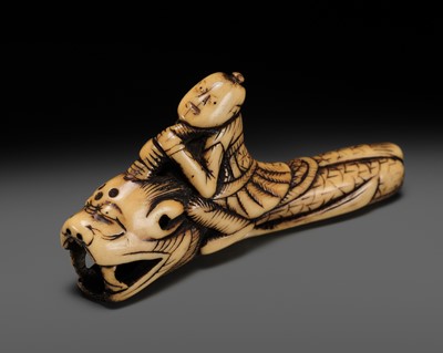 Lot 307 - A RARE ANTLER NETSUKE OF AN IMMORTAL RIDING A SHACHIHOKO (DRAGONFISH)