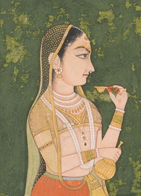 Lot 591 - A MINIATURE PAINTING OF A YOUNG LADY HOLDING A WINE CUP, RAJASTHAN, LATE 18TH TO EARLY 19TH CENTURY