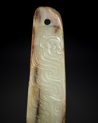 Lot 160 - AN EXCEPTIONAL AND EXCEEDINGLY RARE WHITE AND RUSSET JADE ‘DRAGON AND HUMAN HEAD’ CEREMONIAL BLADE, WESTERN ZHOU DYNASTY