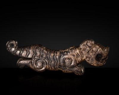 Lot 158 - A FINE MOTTLED BROWN JADE ‘TIGER’ PENDANT, WESTERN ZHOU DYNASTY