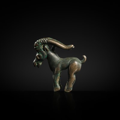 Lot 117 - A CHARMING BRONZE ORNAMENT OF AN IBEX, 5TH-4TH CENTURY BC