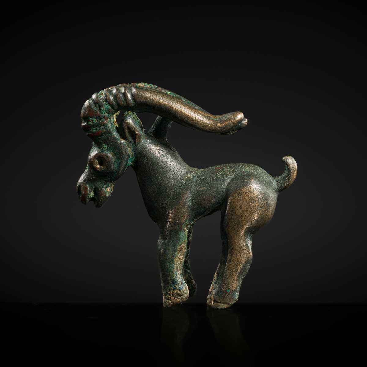 Lot 117 - A CHARMING BRONZE ORNAMENT OF AN IBEX, 5TH-4TH CENTURY BC