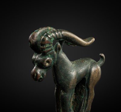 Lot 117 - A CHARMING BRONZE ORNAMENT OF AN IBEX, 5TH-4TH CENTURY BC