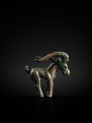 Lot 117 - A CHARMING BRONZE ORNAMENT OF AN IBEX, 5TH-4TH CENTURY BC