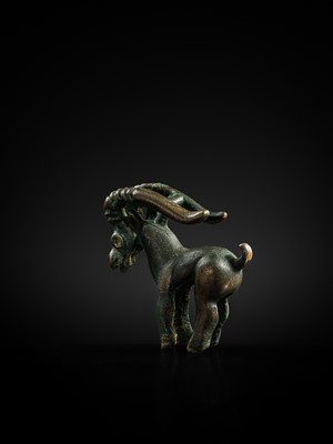 Lot 117 - A CHARMING BRONZE ORNAMENT OF AN IBEX, 5TH-4TH CENTURY BC