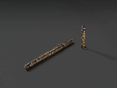 Lot 5 - A RETICULATED GILT-DAMASCENED IRON PEN CASE, TIBET, 15TH-16TH CENTURY