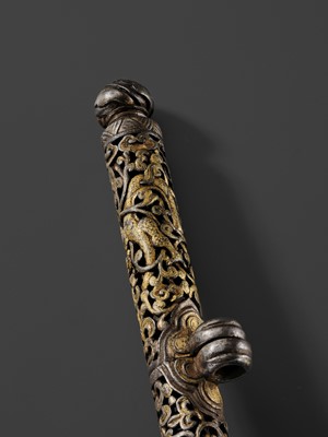 Lot 5 - A RETICULATED GILT-DAMASCENED IRON PEN CASE, TIBET, 15TH-16TH CENTURY