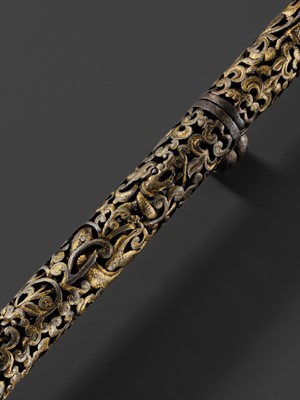 Lot 5 - A RETICULATED GILT-DAMASCENED IRON PEN CASE, TIBET, 15TH-16TH CENTURY
