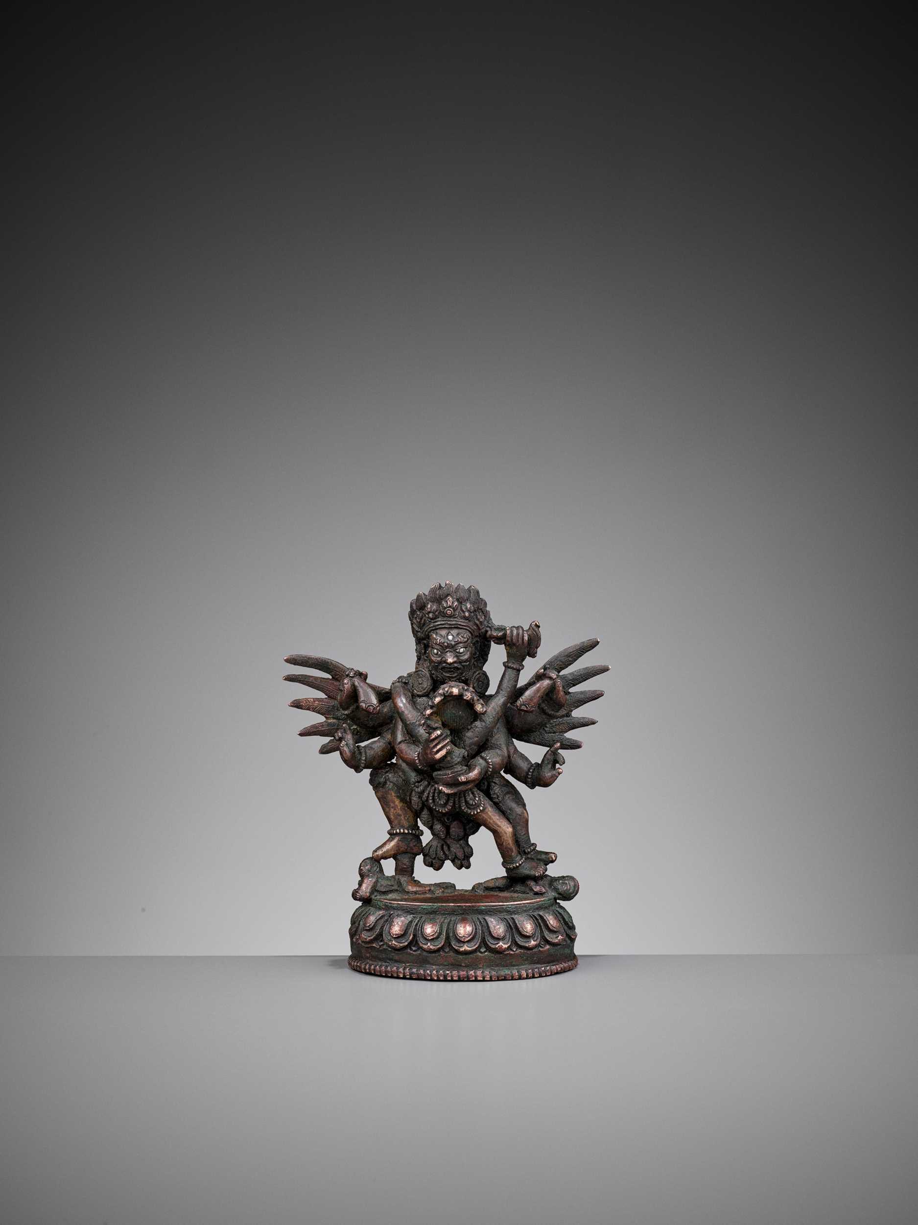 Lot 93 - A SILVER-INLAID BRONZE FIGURE OF HERUKA AND CONSORT, QING