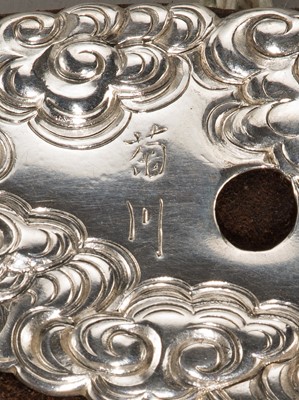 Lot 61 - KIKUGAWA: A LEATHER TABAKO-IRE (POUCH) WITH A SUPERB DRAGON GOLD AND SILVER KANAMONO (POUCH CLASP)