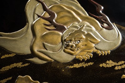 ZOHIKO: A FINE LACQUER SUZURIBAKO (WRITING BOX) DEPICTING A KOMAINU