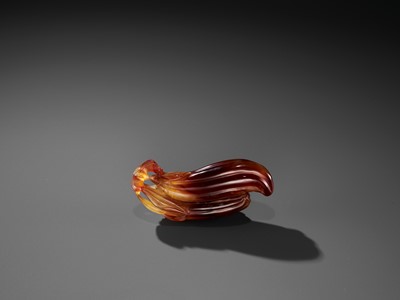 Lot 37 - A FINE AGATE ‘MELON AND BOY’ GROUP, QING