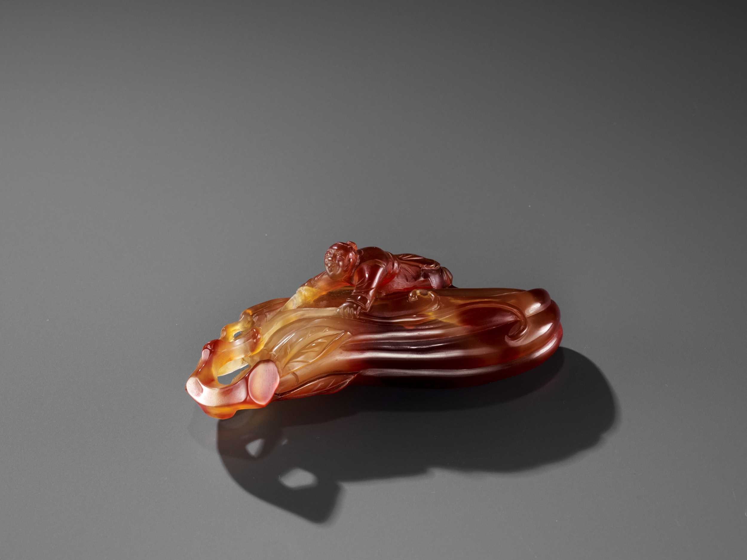 Lot 37 - A FINE AGATE ‘MELON AND BOY’ GROUP, QING